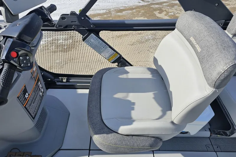 Slide: The Image of 2023 Sea-Doo Switch Cruise 21 driver's seat and controls, showcasing comfort and design. - 63