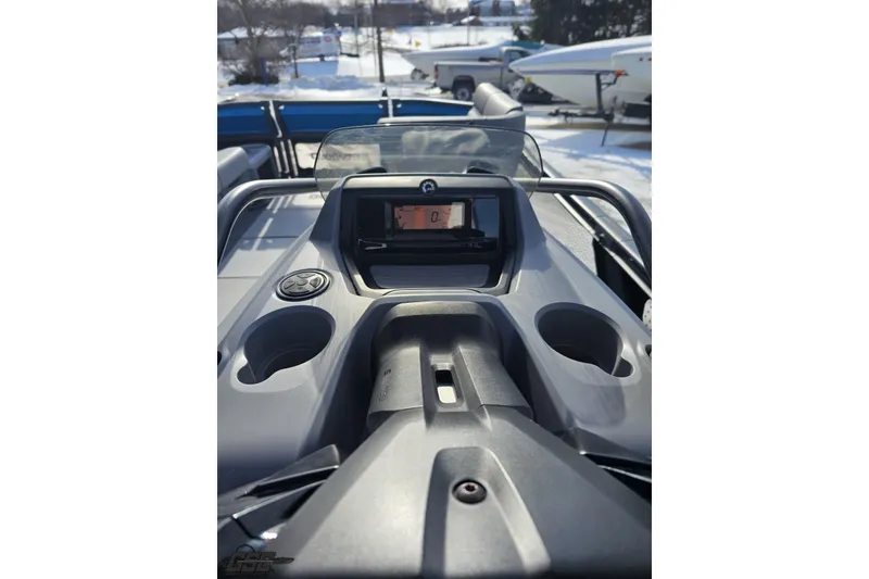 Slide: The Image of 2023 Sea-Doo Switch Cruise 21 dashboard with cup holders and digital display. - 69