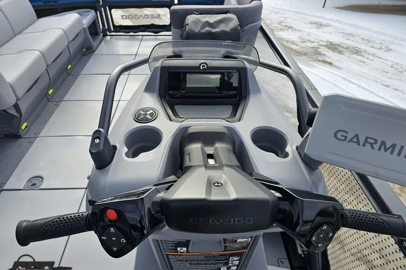 Slide: The Image of 2023 Sea-Doo Switch Cruise 21 dashboard with controls and Garmin navigation system. - 73