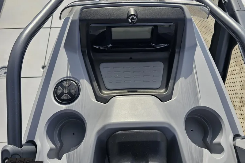 Slide: The Image of 2023 Sea-Doo Switch Cruise 21 dashboard with controls and cup holders. - 74