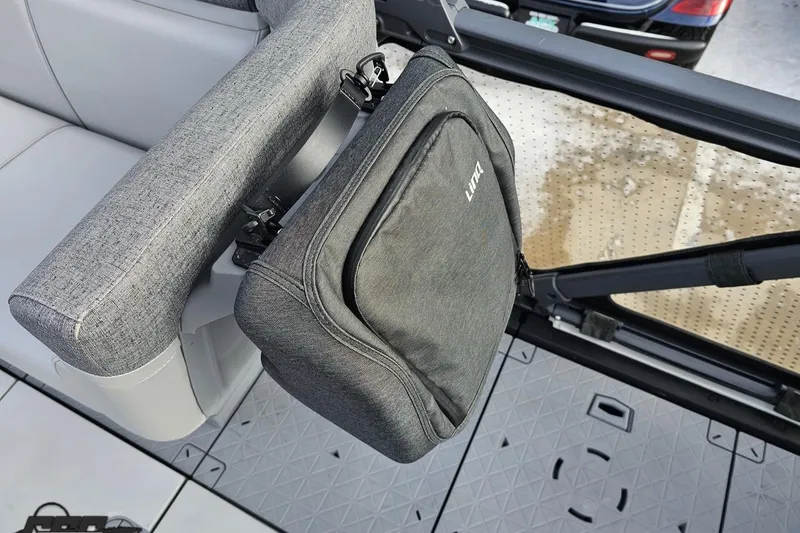 Slide: The Image of 2023 Sea-Doo Switch Cruise 21 interior with attached storage bag. - 80