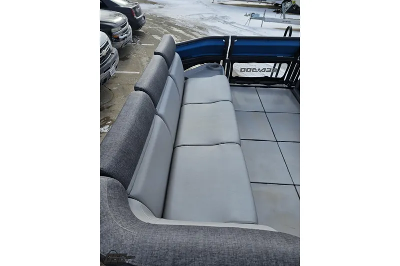 Slide: The Image of 2023 Sea-Doo Switch Cruise 21 with spacious gray seating and sleek design. - 82