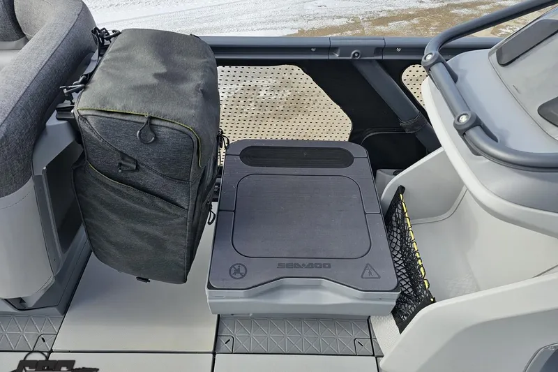 Slide: The Image of 2023 Sea-Doo Switch Cruise 21 interior with storage compartment and seating area. - 85