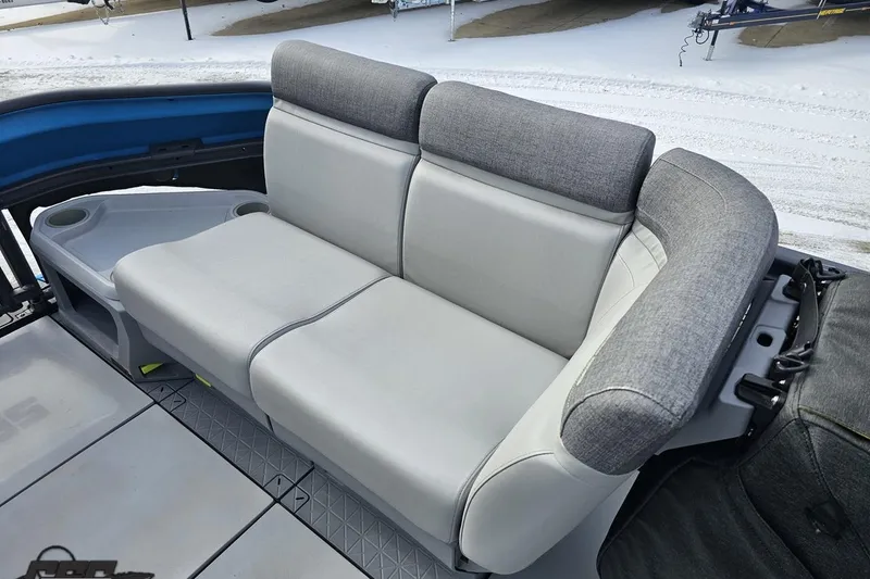Slide: The Image of 2023 Sea-Doo Switch Cruise 21 interior seating with gray upholstery and cup holders. - 88