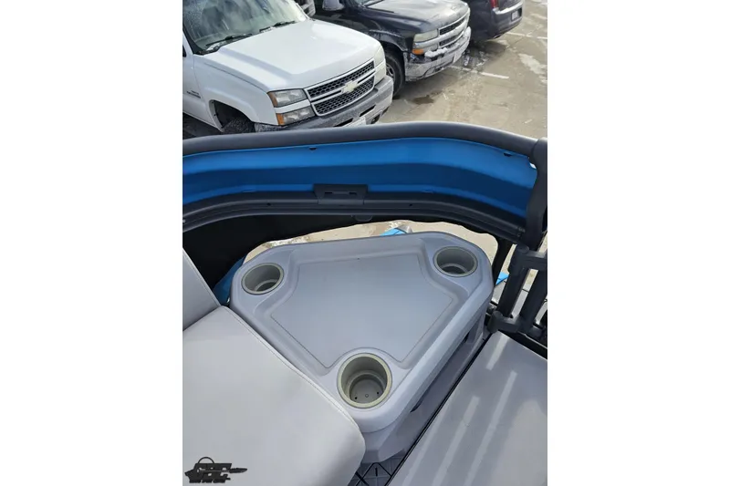 Slide: The Image of 2023 Sea-Doo Switch Cruise 21 interior with cup holders and seating. - 94