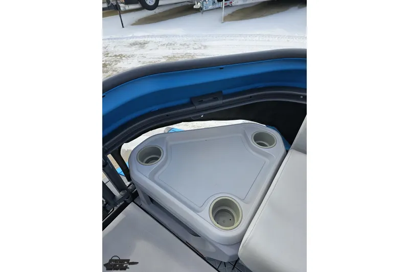 Slide: The Image of 2023 Sea-Doo Switch Cruise 21 interior with cup holders and seating. - 96