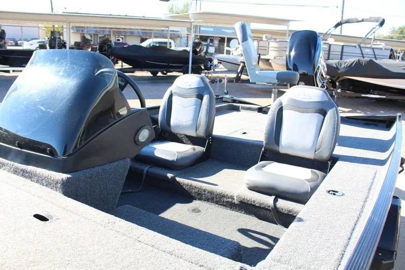 Slide: The Image of 2023 Lowe Skorpion 17 boat interior with dual seats and steering console. - 12