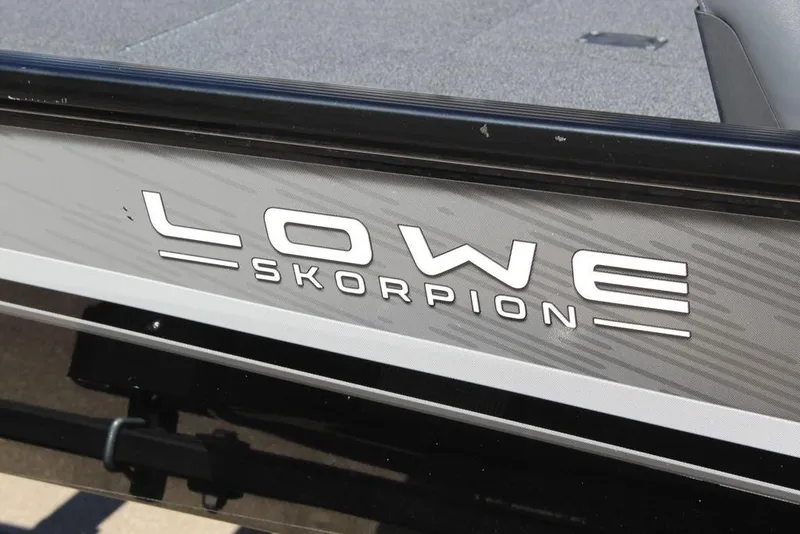 Slide: The Image of 2023 Lowe Skorpion 17 boat logo on sleek exterior design. - 14