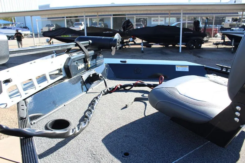 Slide: The Image of 2023 Lowe Skorpion 17 boat interior with seating and motor controls. - 9