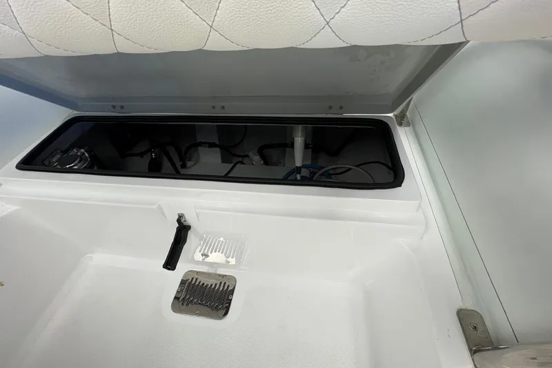 Slide: The Image of 2025 Novurania DL 550 boat with Yamaha 115 engine, displayed indoors on blue floor. - 5