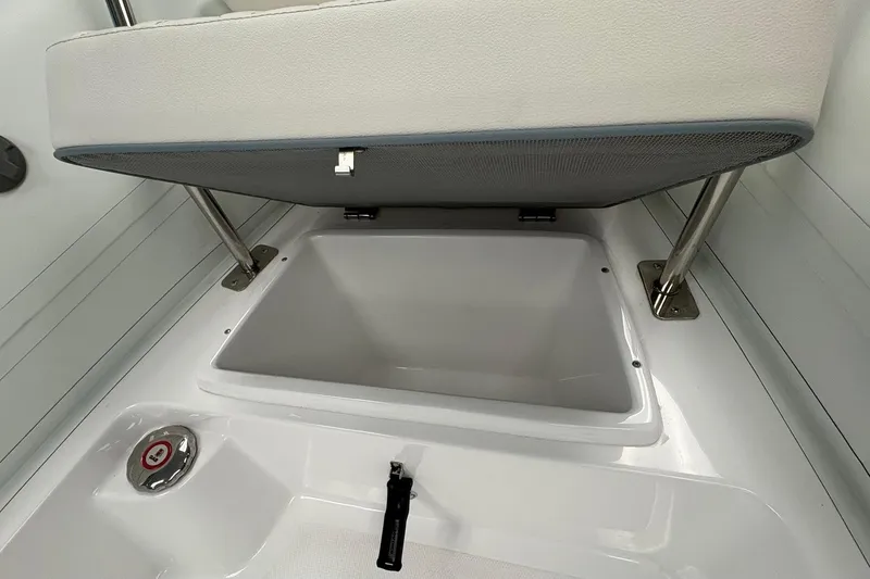 Slide: The Image of 2025 Novurania DL 550 boat storage compartment with open cushioned seat. - 7