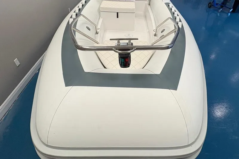 Slide: The Image of Open storage compartment in 2025 Novurania DL 550 boat with cushioned seat. - 8