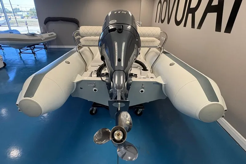 Slide: The Image of 2025 Novurania DL 550 boat storage compartment with open lid, showcasing interior details. - 9