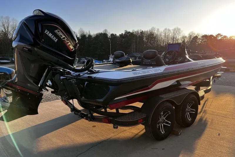 Slide: The Image of 2023 Skeeter ZX200 boat with Yamaha engine, parked outdoors at sunset. - 23