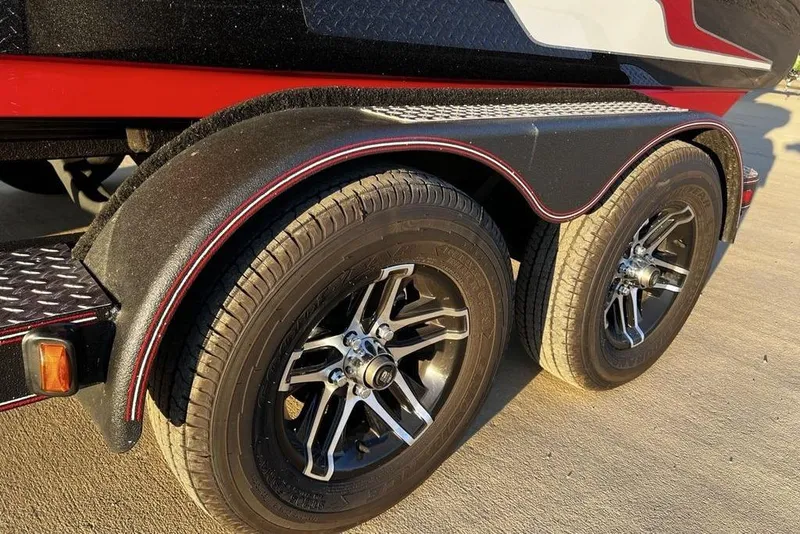 Slide: The Image of 2023 Skeeter ZX200 trailer with dual wheels and stylish black rims. - 3