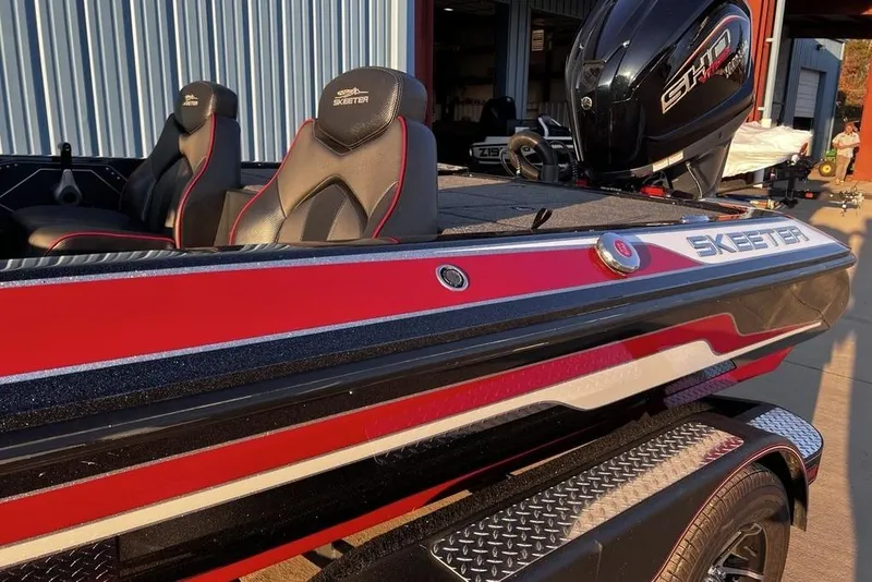 Slide: The Image of 2023 Skeeter ZX200 boat with red and black design, featuring sleek seating and powerful engine. - 4