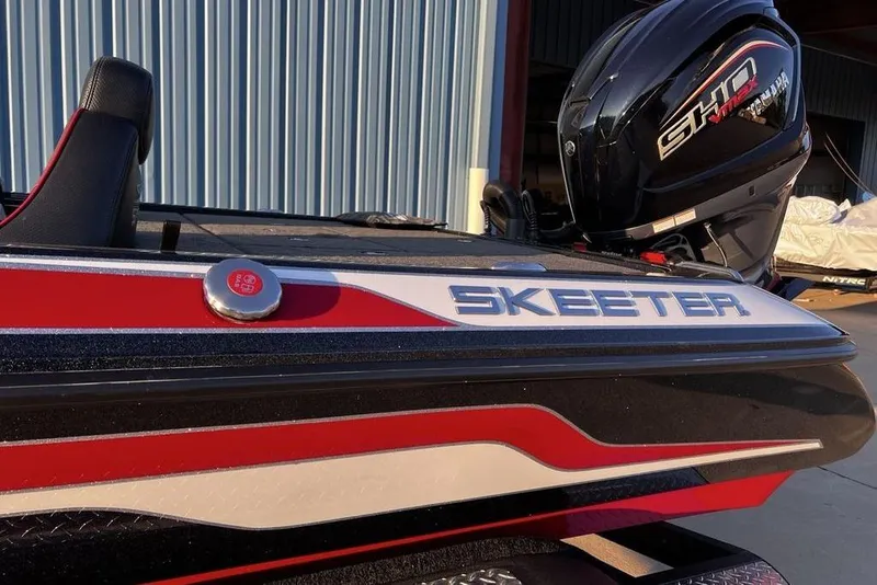 Slide: The Image of 2023 Skeeter ZX200 boat with Yamaha SHO engine, red and black design. - 6