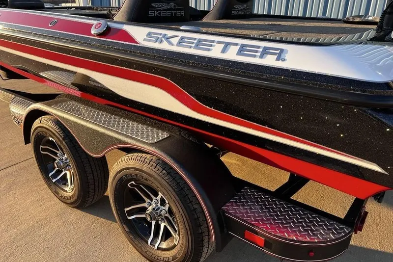 Slide: The Image of 2023 Skeeter ZX200 boat on trailer, featuring sleek design and vibrant red accents. - 8