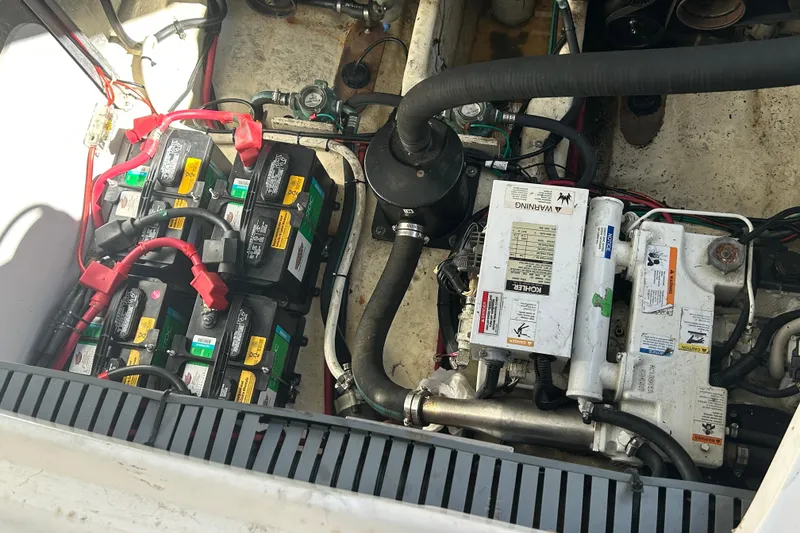 Slide: The Image of 2007 Sea Ray Sundancer 310 docked at marina, showcasing sleek design and spacious deck. - 2