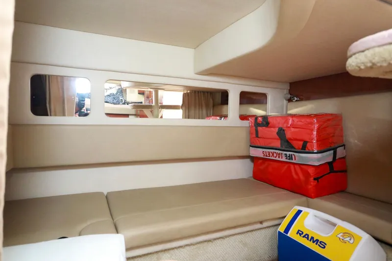 Slide: The Image of 2007 Sea Ray Sundancer 310 cabin interior with life jackets and storage. - 20