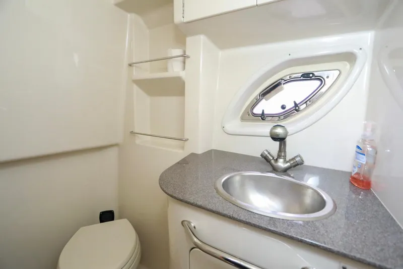 Slide: The Image of Bathroom interior of 2007 Sea Ray Sundancer 310 yacht with sink and porthole. - 21