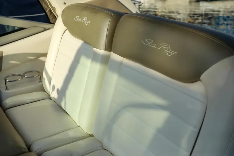 Slide: The Image of 2007 Sea Ray Sundancer 310 boat seats with cup holders, featuring elegant design. - 9