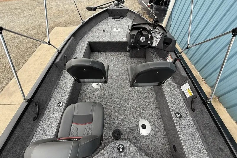 Slide: The Image of 2026 Tracker Pro Guide V-16 SC boat interior with dual seats and steering console. - 20