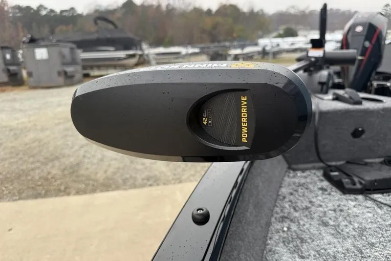 Slide: The Image of Close-up of a 2026 Tracker Pro Guide V-16 SC boat's PowerDrive motor in a marina. - 4