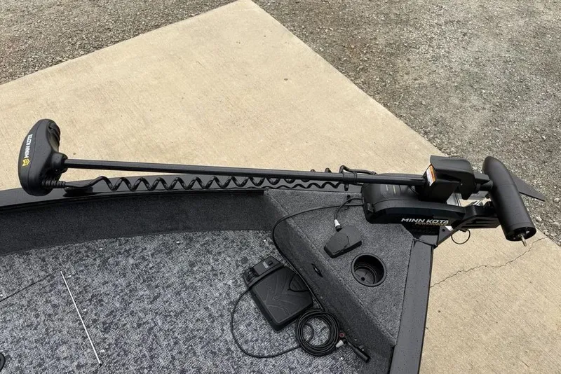 Slide: The Image of 2026 Tracker Pro Guide V-16 SC boat with Minn Kota trolling motor on deck. - 6