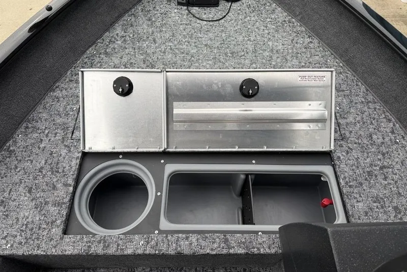 Slide: The Image of 2026 Tracker Pro Guide V-16 SC boat interior with storage compartments and pump-out feature. - 9