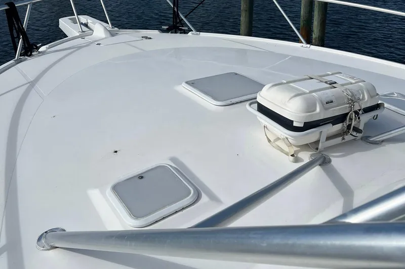 Slide: The Image of 2007 Luhrs 41 Hardtop boat deck with safety equipment and railing. - 13