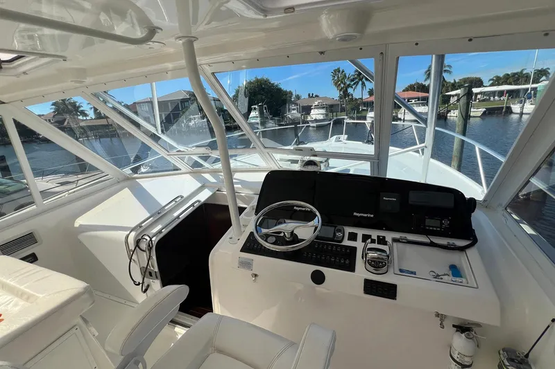 Slide: The Image of 2007 Luhrs 41 Hardtop boat helm with steering wheel and navigation equipment. - 20