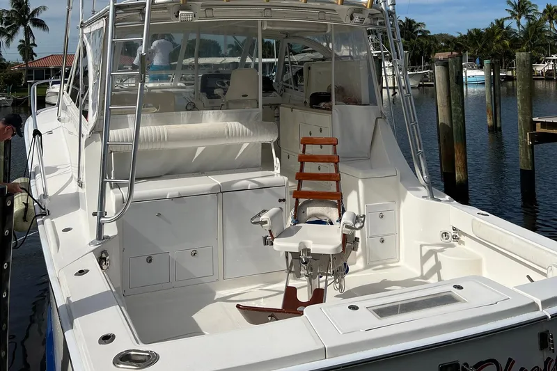 Slide: The Image of 2007 Luhrs 41 Hardtop boat with spacious deck and fishing chair. - 23