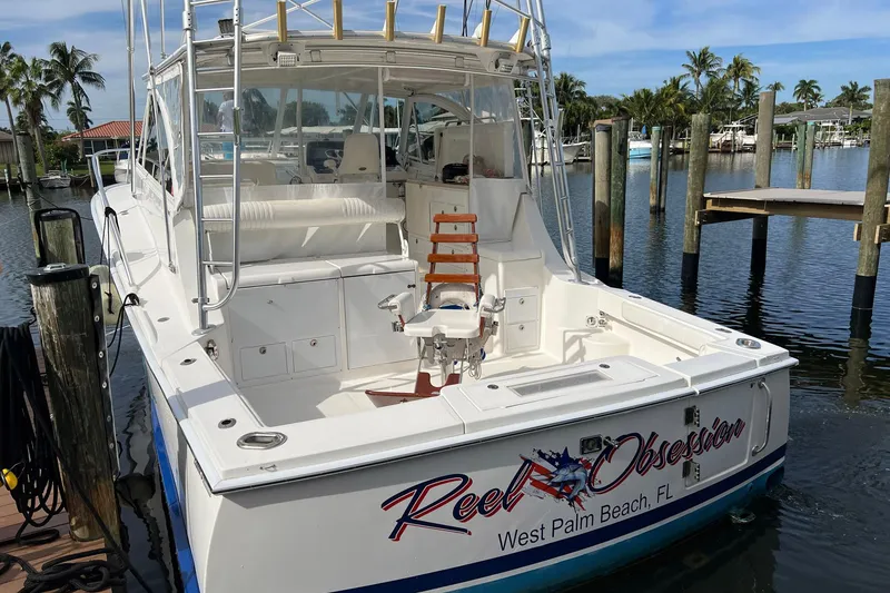 Slide: The Image of 2007 Luhrs 41 Hardtop boat docked in West Palm Beach marina. - 25