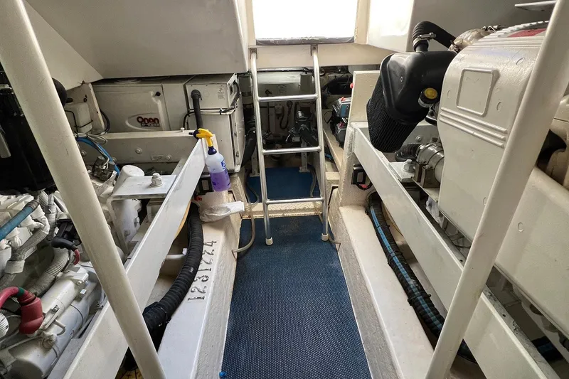 Slide: The Image of Engine room of 2007 Luhrs 41 Hardtop boat with visible machinery and equipment. - 26