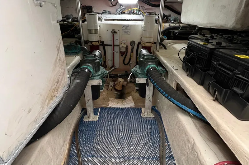 Slide: The Image of Engine room of 2007 Luhrs 41 Hardtop boat with visible machinery and components. - 28