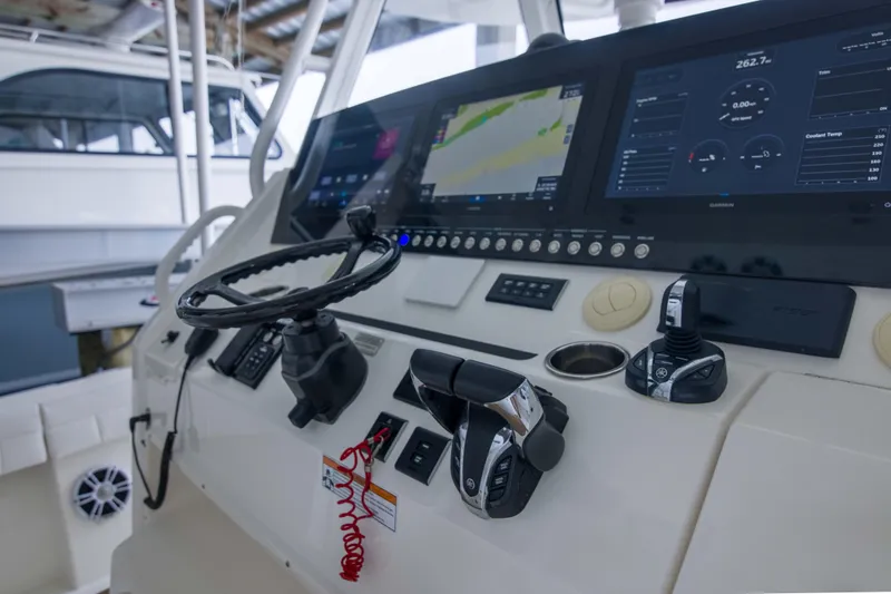 Slide: The Image of Control panel of a 2021 Regulator 41 boat with advanced navigation displays. - 1