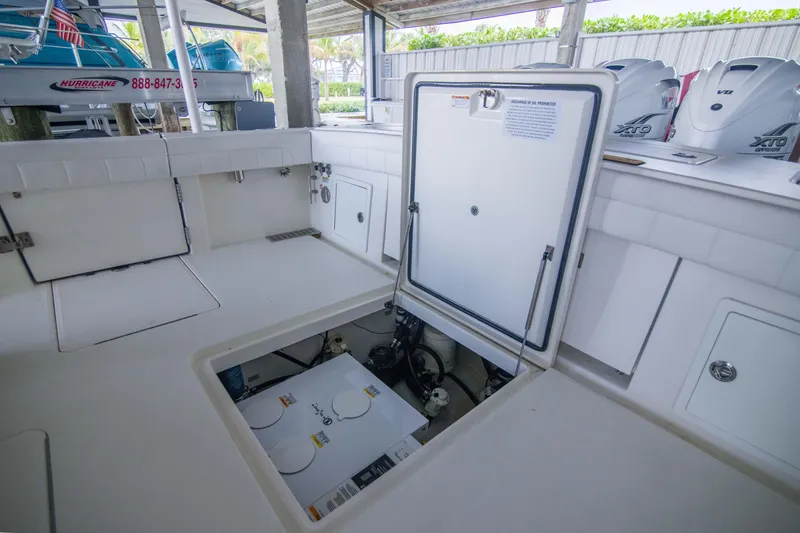 Slide: The Image of 2021 Regulator 41 boat interior with open hatch and visible engine components. - 16