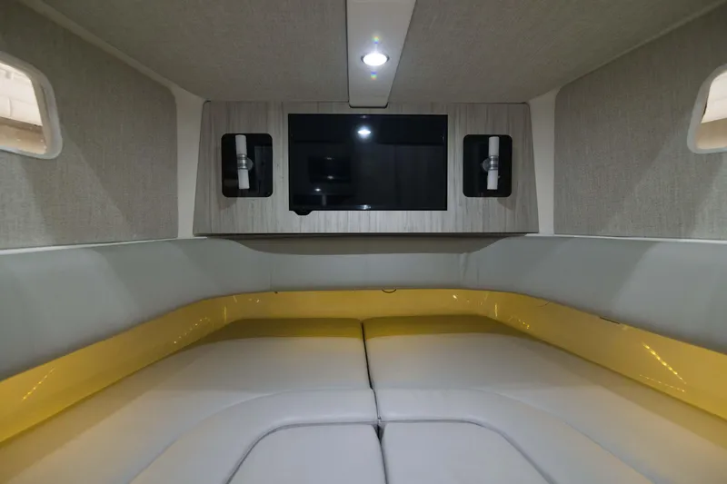 Slide: The Image of Interior cabin of 2021 Regulator 41 boat with modern seating and TV. - 18