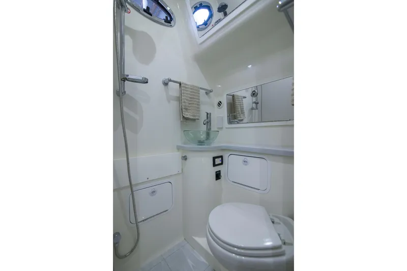 Slide: The Image of 2021 Regulator 41 boat bathroom with shower, sink, and toilet. - 20