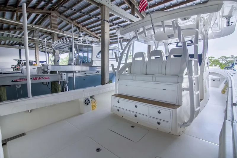 Slide: The Image of 2021 Regulator 41 boat interior with seating and storage under covered dock. - 3