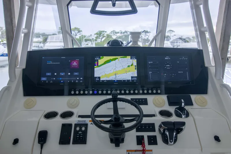 Slide: The Image of 2021 Regulator 41 boat dashboard with advanced navigation and control systems. - 5
