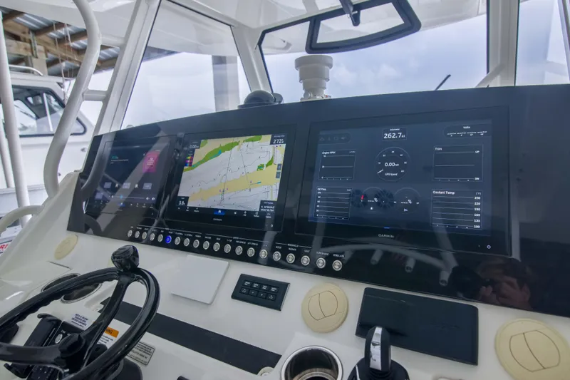 Slide: The Image of Control panel of a 2021 Regulator 41 boat with navigation and engine displays. - 6