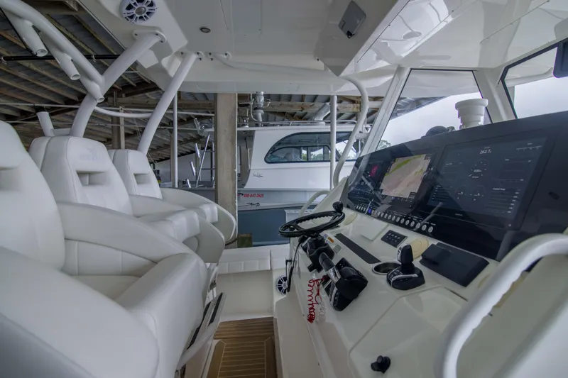 Slide: The Image of 2021 Regulator 41 boat interior with advanced navigation system and luxurious seating. - 8