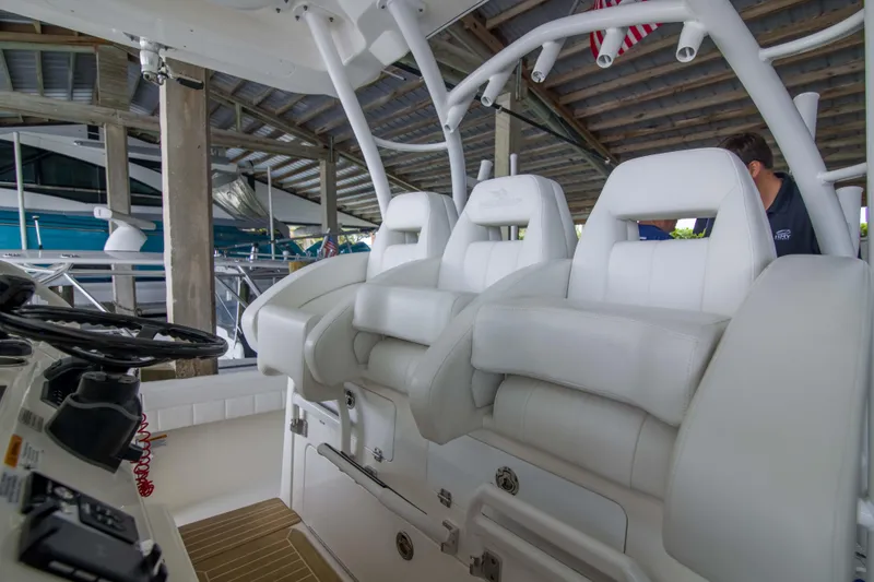 Slide: The Image of 2021 Regulator 41 boat interior with white seating and steering console. - 9
