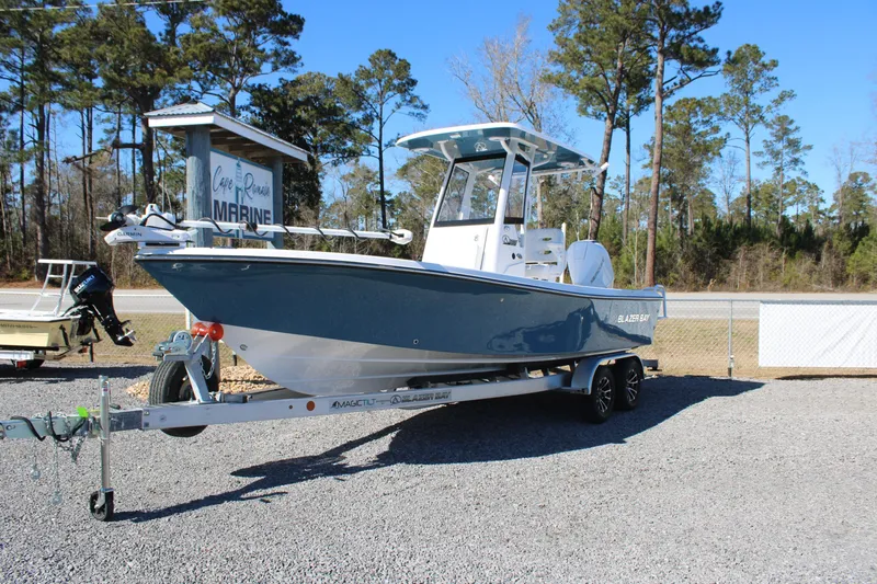 The Image of 2026 Blazer Bay 2440 boat on trailer at Cape Romaine Marine dealership. - 1