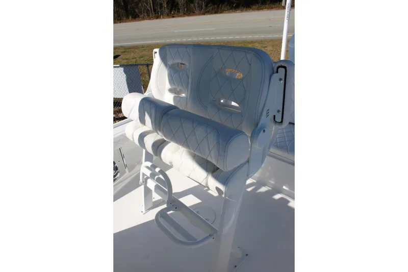 Slide: The Image of White leather boat seat on 2026 Blazer Bay 2440, featuring diamond stitching and footrest. - 10