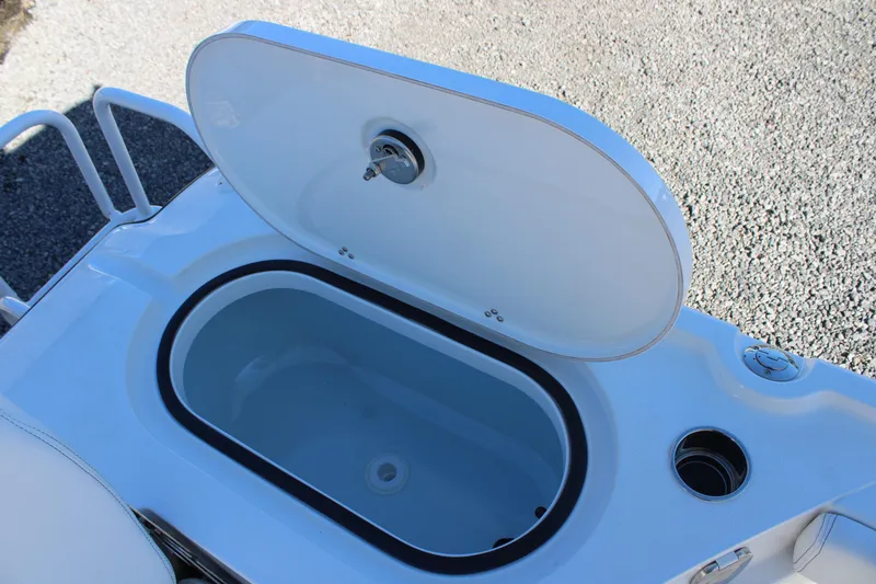 Slide: The Image of Open storage compartment on 2026 Blazer Bay 2440 boat, showcasing interior design. - 14