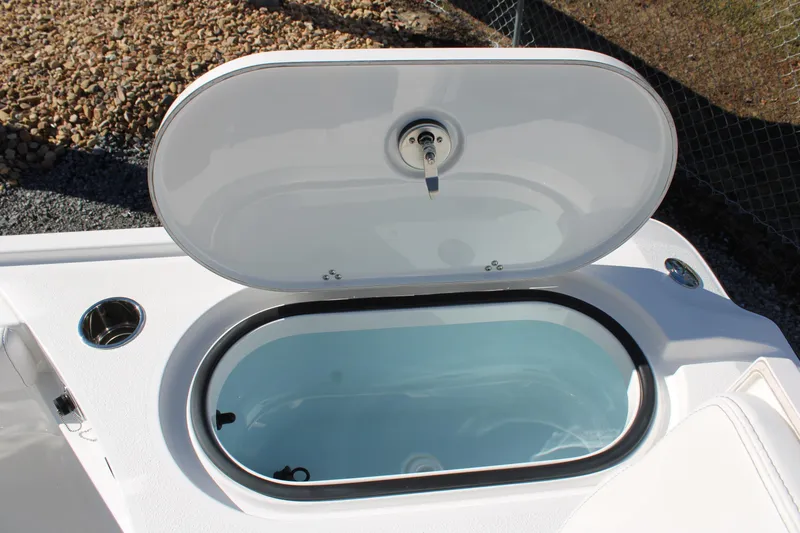 Slide: The Image of Open storage compartment on 2026 Blazer Bay 2440 boat, showcasing interior design. - 15