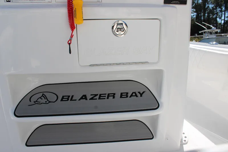 Slide: The Image of 2026 Blazer Bay 2440 boat interior with logo and safety equipment. - 19